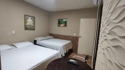 Uma cama ou camas num quarto em Hotel Nacional