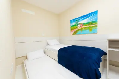 Uma cama ou camas num quarto em Dei Fiori Guaramiranga