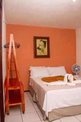 Uma cama ou camas num quarto em Pousada de serra TUTUCA
