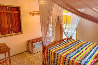 Uma cama ou camas num quarto em Pousada Quinta da Lagoa Azul