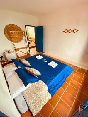 Uma cama ou camas num quarto em Montepascual Ecovillage