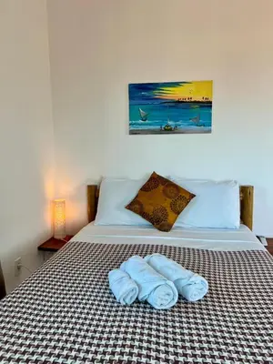 Uma cama ou camas num quarto em Casa da Juma