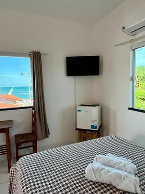 Uma cama ou camas num quarto em Casa da Juma
