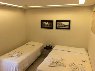 Uma cama ou camas num quarto em Angra Praia Hotel