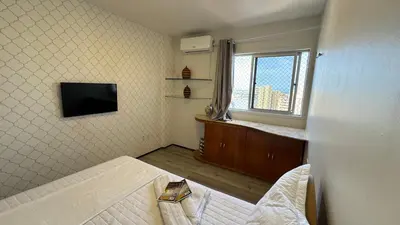 Uma televisão e/ou sistema de entretenimento em Apartamento Praia de Iracema com vista mar
