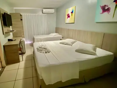 Uma cama ou camas num quarto em Hotel Fortaleza Inn