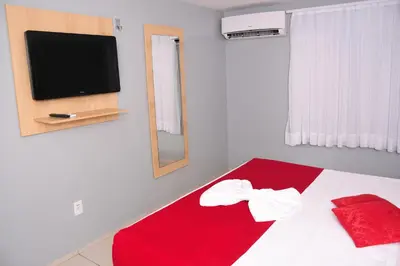 Uma televisão e/ou sistema de entretenimento em Hotel Fortaleza Inn