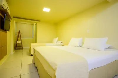 Uma cama ou camas num quarto em Nordeste Palace Hotel - Fortaleza