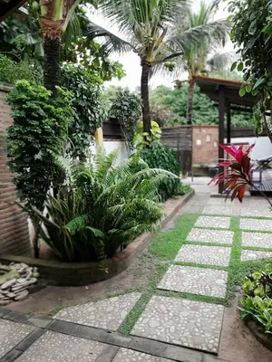 Um jardim no exterior de Pousada do farol