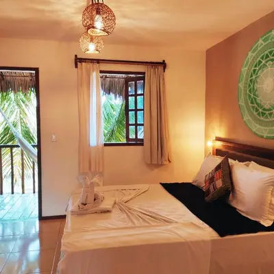 Uma cama ou camas num quarto em Pousada Tropical Brasil Jeri