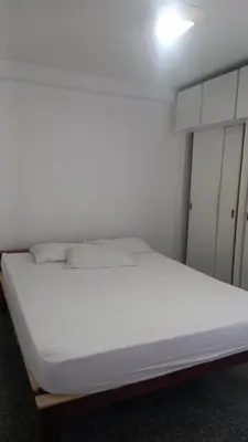 Uma cama ou camas num quarto em Hotel Flat Atlântico