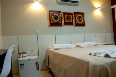 Uma cama ou camas num quarto em Murano Center Hotel