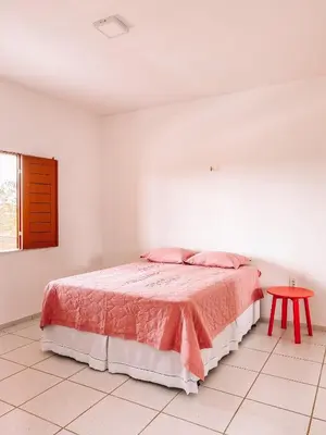 Uma cama ou camas num quarto em Mansão Beberibe