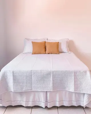 Uma cama ou camas num quarto em Mansão Beberibe
