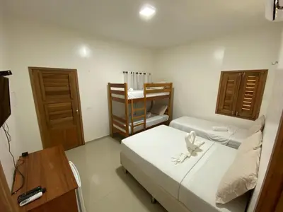Uma cama ou camas num quarto em Pousada Casa da Cion