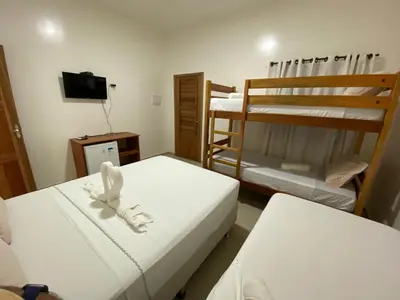 Uma cama ou camas num quarto em Pousada Casa da Cion