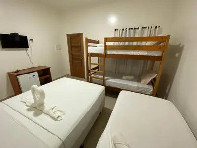 Uma cama ou camas num quarto em Pousada Casa da Cion