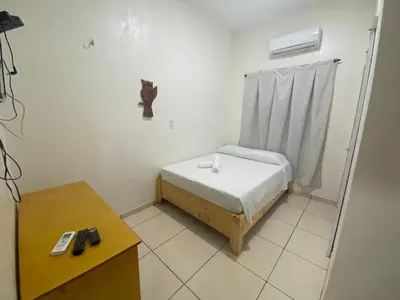 Uma cama ou camas num quarto em Pousada Casa da Cion