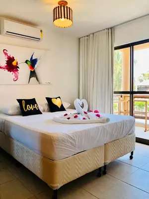 Uma cama ou camas num quarto em Cumbuco Dream Village Luxury Condo