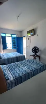 Uma cama ou camas num quarto em Porto Canoa Apartamento