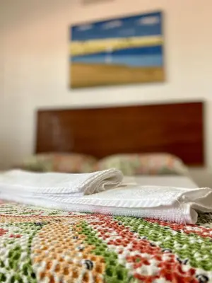 Uma cama ou camas num quarto em Pousada São Pedro