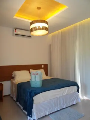 Uma cama ou camas num quarto em Junduh Brasil Pousada e Restaurante