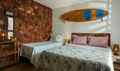 Uma cama ou camas num quarto em Pousada AGUA SALGADA