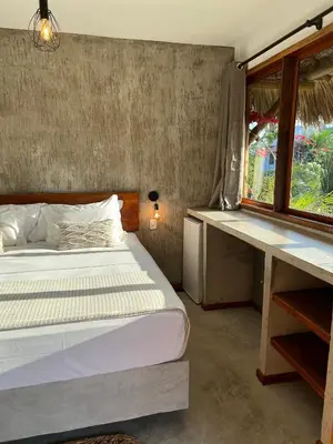 Uma cama ou camas num quarto em Casa Valentini Pousada