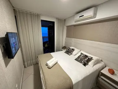 Uma cama ou camas num quarto em Landscape Beira Mar torre Platinum - vista incrível mar