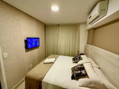 Uma cama ou camas num quarto em Landscape Beira Mar torre Platinum - vista incrível mar