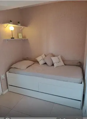 Uma cama ou camas num quarto em Apartamento térreo Aquaville
