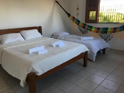 Uma cama ou camas num quarto em Beach House Paracuru - Casa da Gabi