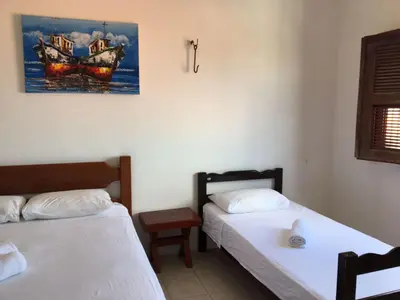 Uma cama ou camas num quarto em Beach House Paracuru - Casa da Gabi