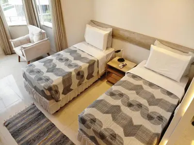 Uma cama ou camas num quarto em APTO LUXO EM HOTEL - BEIRA MAR FORTALEZA