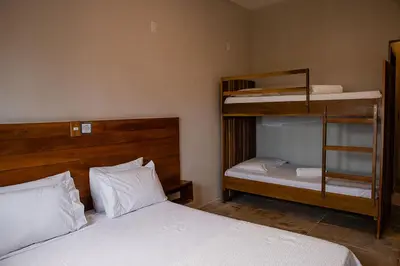 Uma cama ou camas num quarto em Casa Naná - Suites