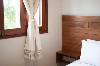 Uma cama ou camas num quarto em Casa Naná - Suites