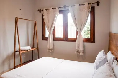 Uma cama ou camas num quarto em Casa Naná - Suites