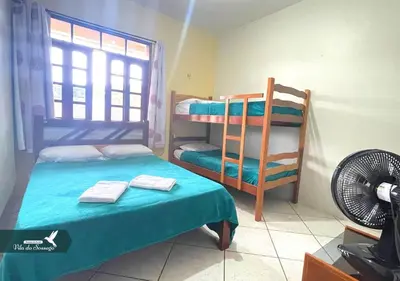 Uma cama ou camas num quarto em Vila do Sossego