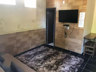 Uma televisão e/ou sistema de entretenimento em Casa YeS Jeri