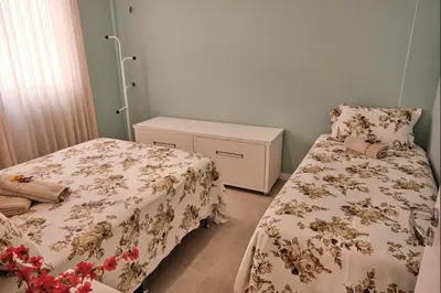 Uma cama ou camas num quarto em TERRAMARIS - APARTAMENTO PÉ NA AREIA