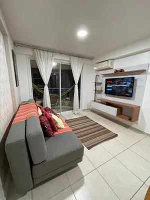 Uma área de estar em Apartamento com Vista para o Mar Último Andar