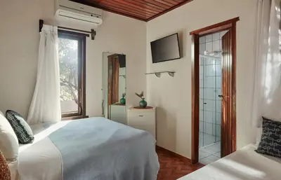 Uma cama ou camas num quarto em Pousada Casa Cecilia