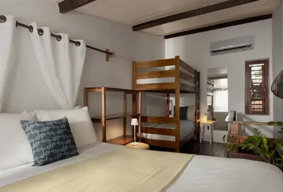 Uma cama ou camas num quarto em Pousada Casa Cecilia