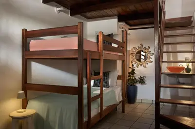 Uma cama ou camas num quarto em Pousada Casa Cecilia