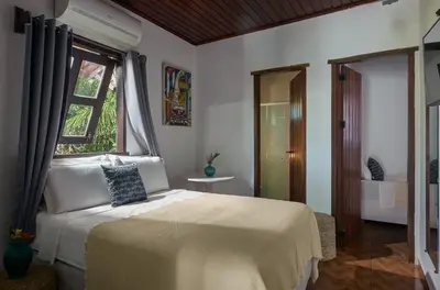 Uma cama ou camas num quarto em Pousada Casa Cecilia
