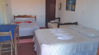Uma cama ou camas num quarto em Pousada Subindo as Dunas