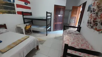 Uma cama ou camas num quarto em Pousada Subindo as Dunas
