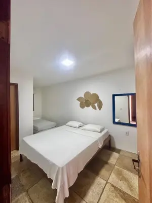 Uma cama ou camas num quarto em Manay Lagoa do Paraíso, casa 2 quartos na beira da Lagoa