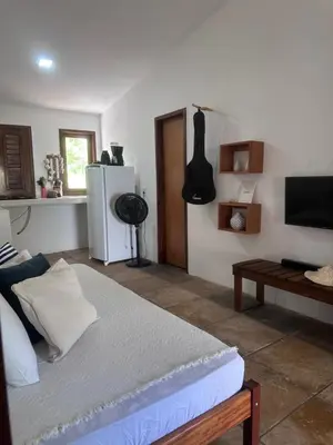Uma televisão e/ou sistema de entretenimento em Manay Lagoa do Paraíso, casa 2 quartos na beira da Lagoa