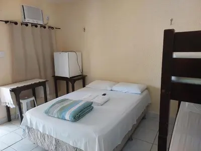 Uma cama ou camas num quarto em Hospedaria Encontro das Águas